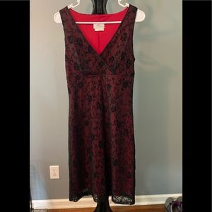 Juniors black lace over red dress.